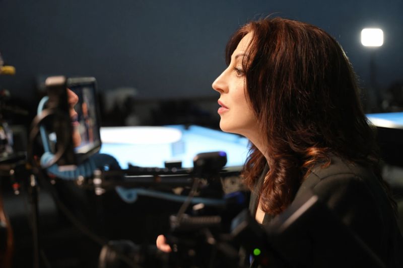 Valerie Smaldone in broadcast studio setting